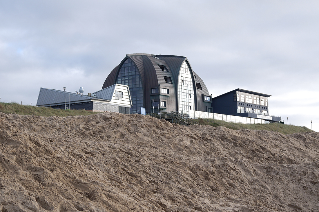 Amsterdam day trips: Bloemendaal aan Zee beach at the North Sea: large hotel seen from the beach 