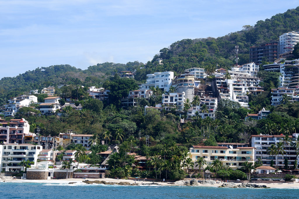 Puerto Vallarta is for the grownups and other stories: view on the resort zone from the water, hotels are nested down the hill