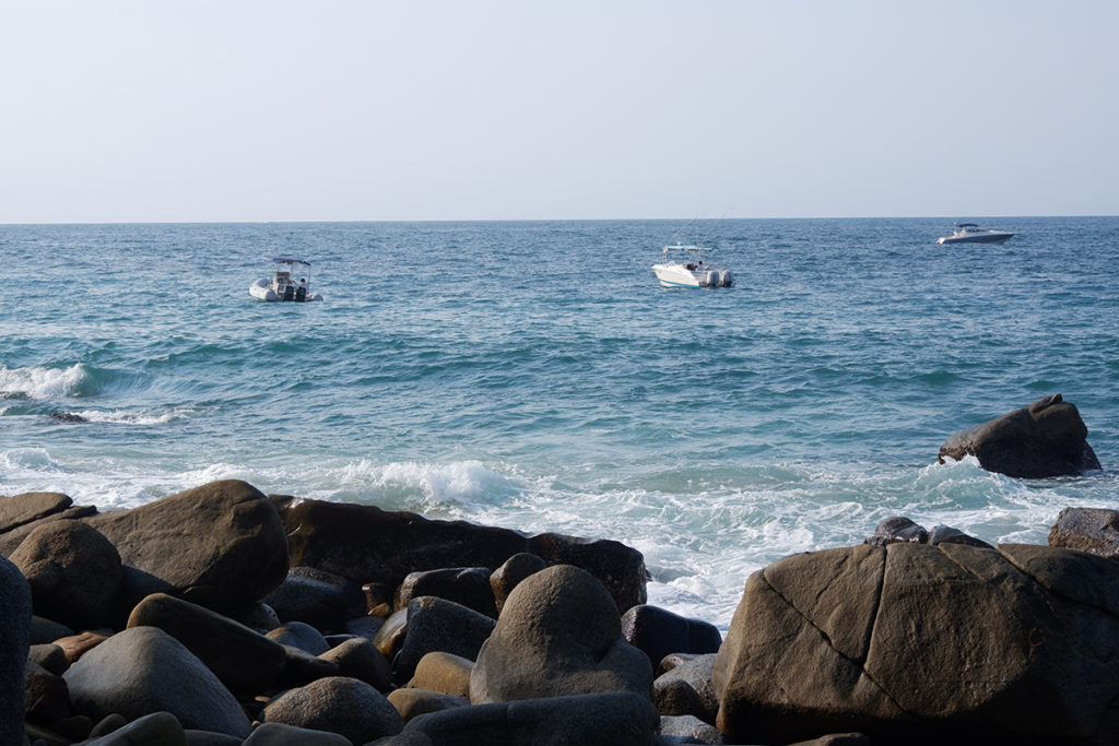 Hiking the Puerto Vallarta's Boca de Tomatlan trail: fishing boats out on the blue water