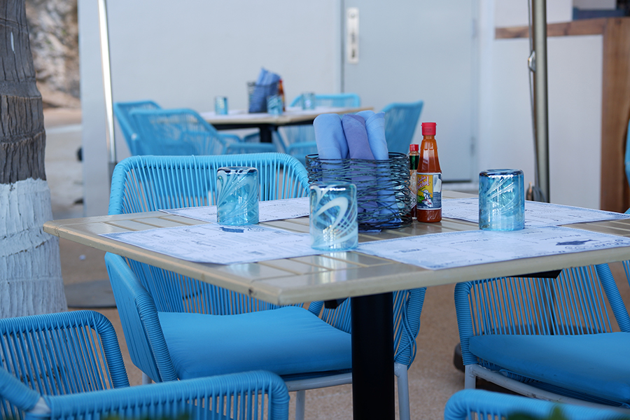 Review of Grand Fiesta Americana Puerto Vallarta: blue chairs set around a cafe table with blue napkins and glasses