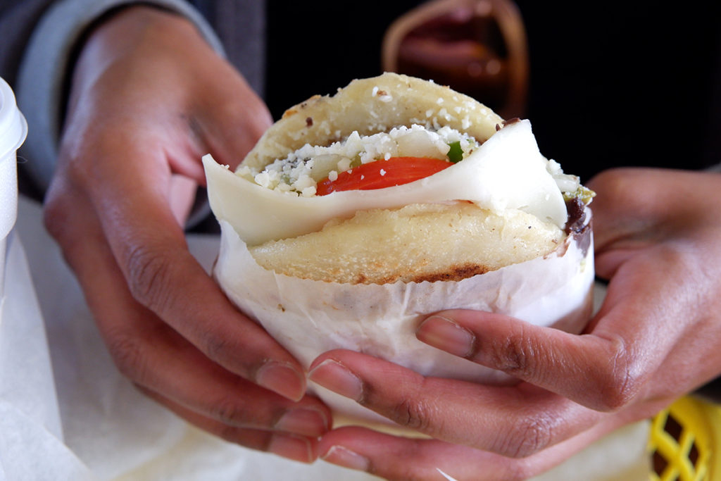 A quick visit to Las Vegas, first timer's perspective: a close up on an arepa with cheese and tomatoes visible 