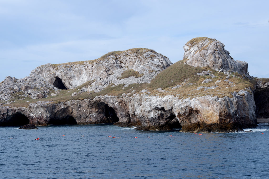 Islas Marietas by boat or No more tequila for Brenda: island close up with multiple caves sitting on the water