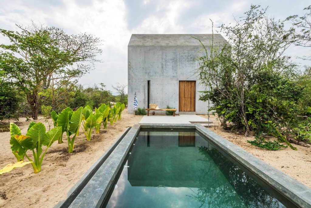 6 unique AirBNB homes in unique locations: concrete house with a minimalistic pool 