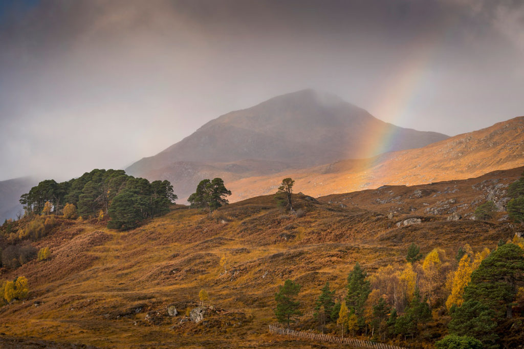 A few amazing places you can visit virtually Scotland mountains and a rainbow 