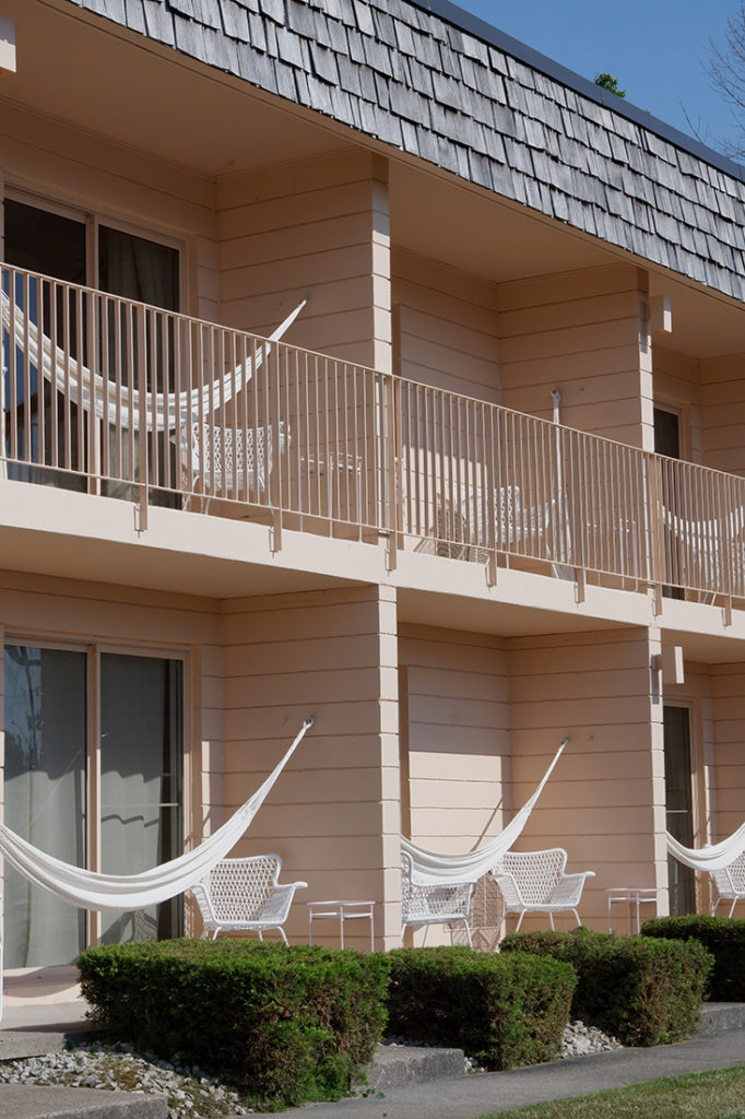 The June Motel: A chic stay in Sauble Beach: view of the motel front with hammocks hanging on each balcony