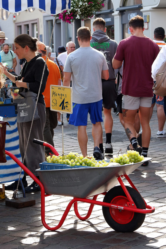 Trier in pictures Roman history, wine, and architecture - green grapes on a wheel barrel 