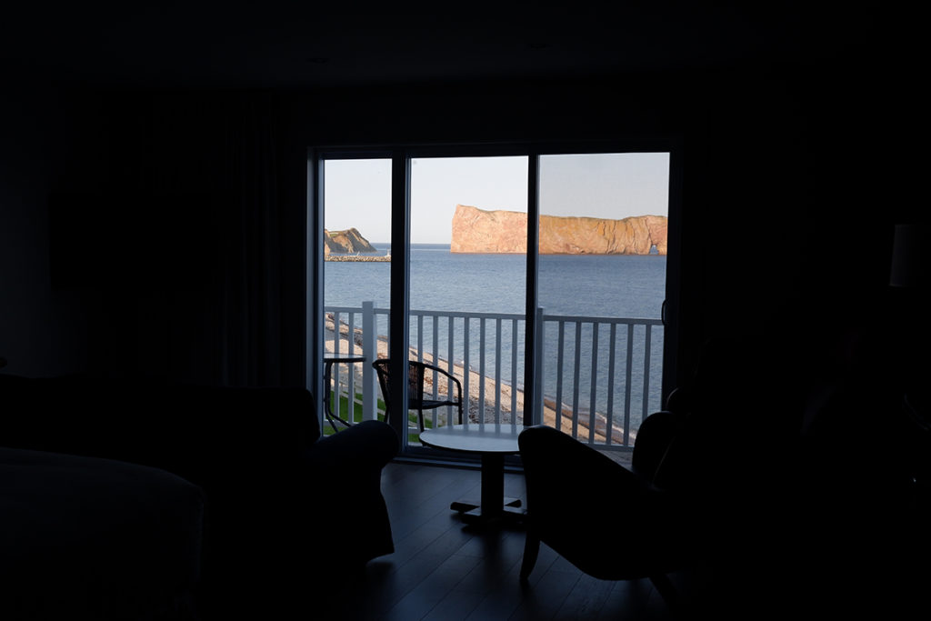 Destination guide: The great adventure through Quebec Maritimes view of the perce rock through the hotel window