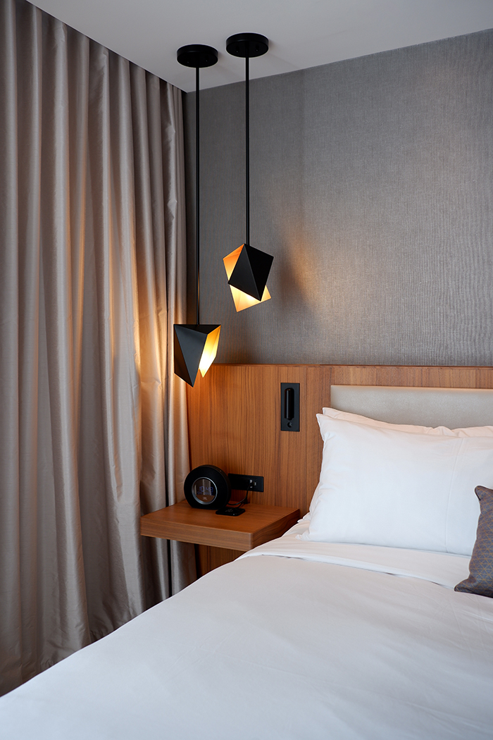 Humaniti Hotel lighting and bed