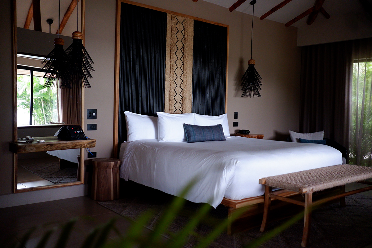 Hotel Punta Islita Costa Rica, Honeymoon Suite: king bed with two bight stands and a mirror 