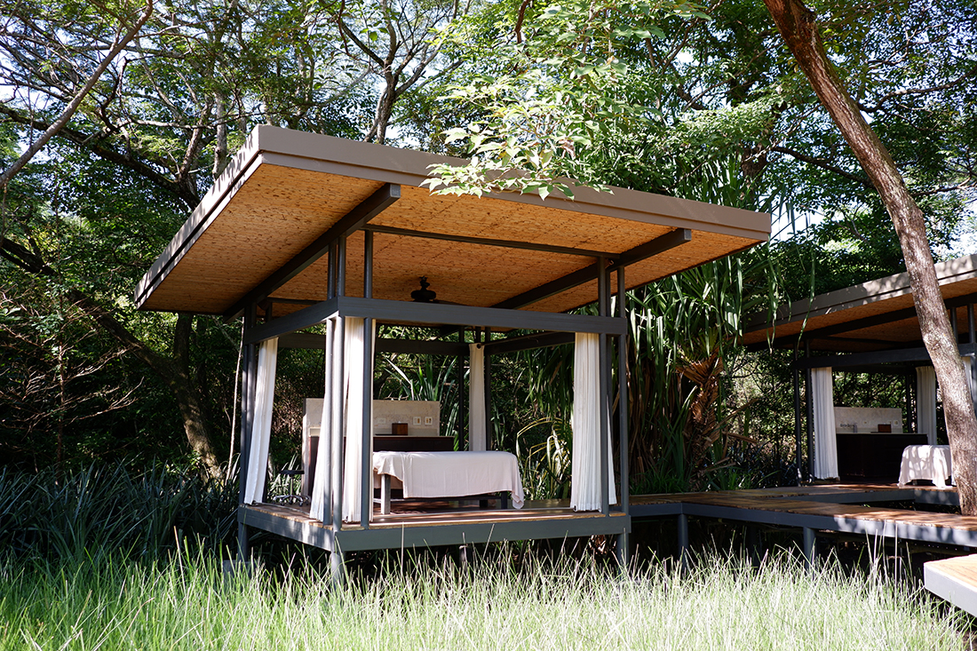 Outdoor spa at the El Mangroove Hotel, Costa Rica. Close up view of the massage cabanas shaded by the trees