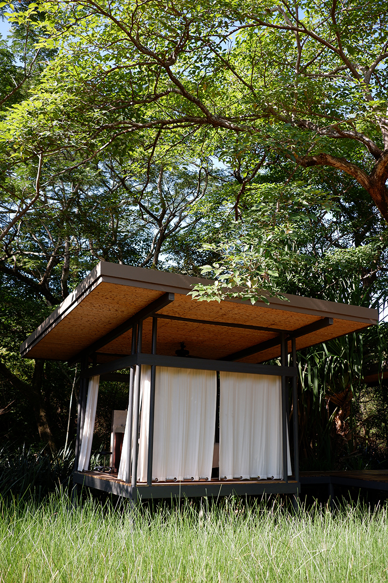 Outdoor spa at the El Mangroove Hotel, Costa Rica. View of a single cabana with curtains closed