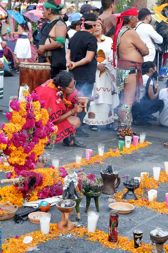 Flower ofrenda on the floor of a city square