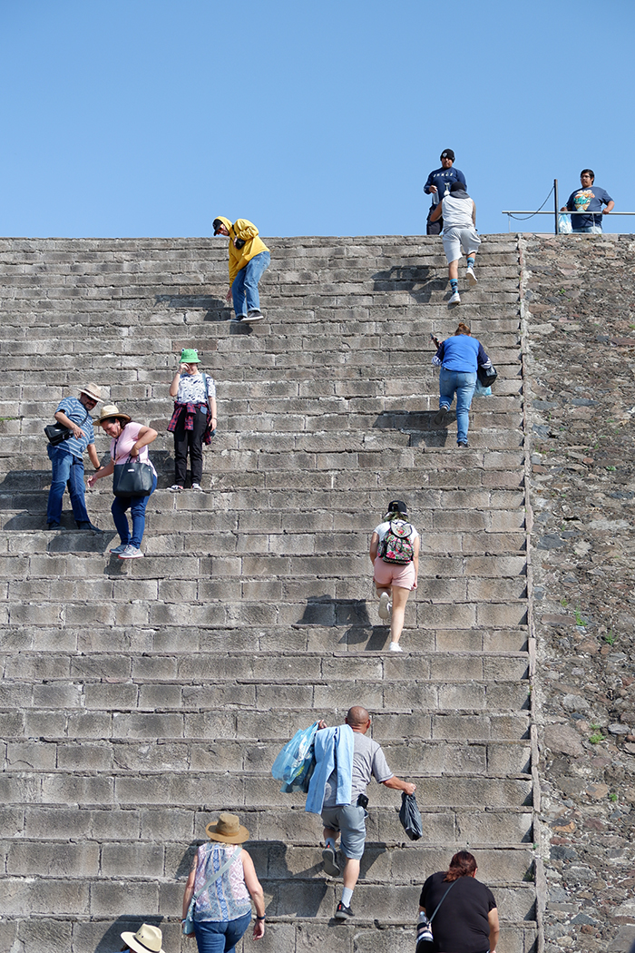 Teotihuacan ruins, steps that go up and over to the pyramid behind them