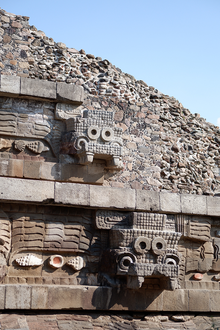 Teotihuacan ruins, close up on pyramid showcasing faces