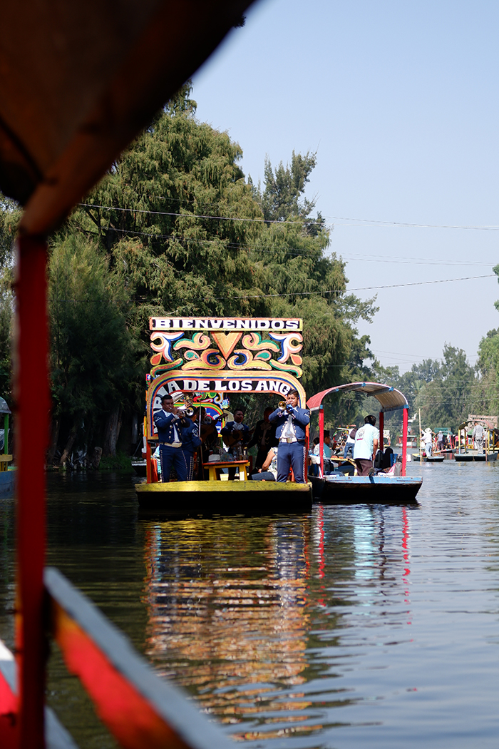 Mariachi band on a trajinera, further away