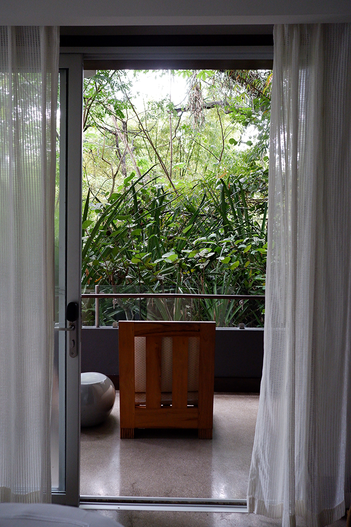 Sleep among the mangrove trees at El Mangroove Hotel, Habitat Superior suite balcony door