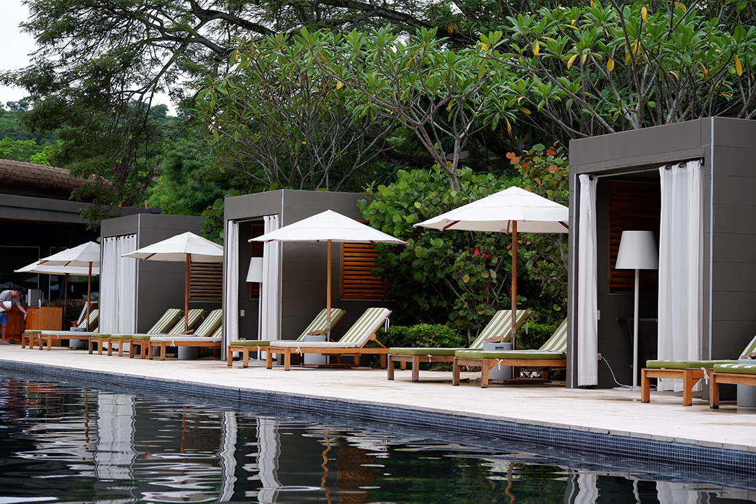 Sleep among the mangrove trees at El Mangroove Hotel,  black tiled pool and cabanas 