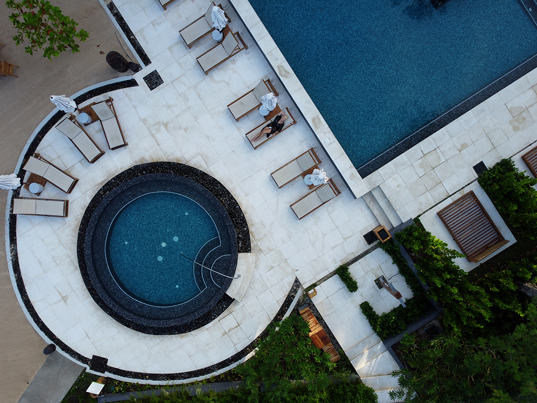 Sleep among the mangrove trees at El Mangroove Hotel: areal photo of a round pool and a corner of a rectangle blue pool