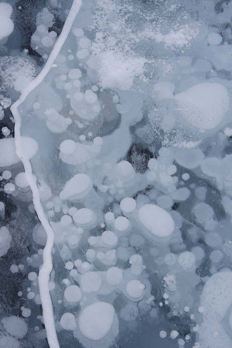 Five things to do in Banff for non-skiers: Abraham Lake close up on the ice with the bubbles