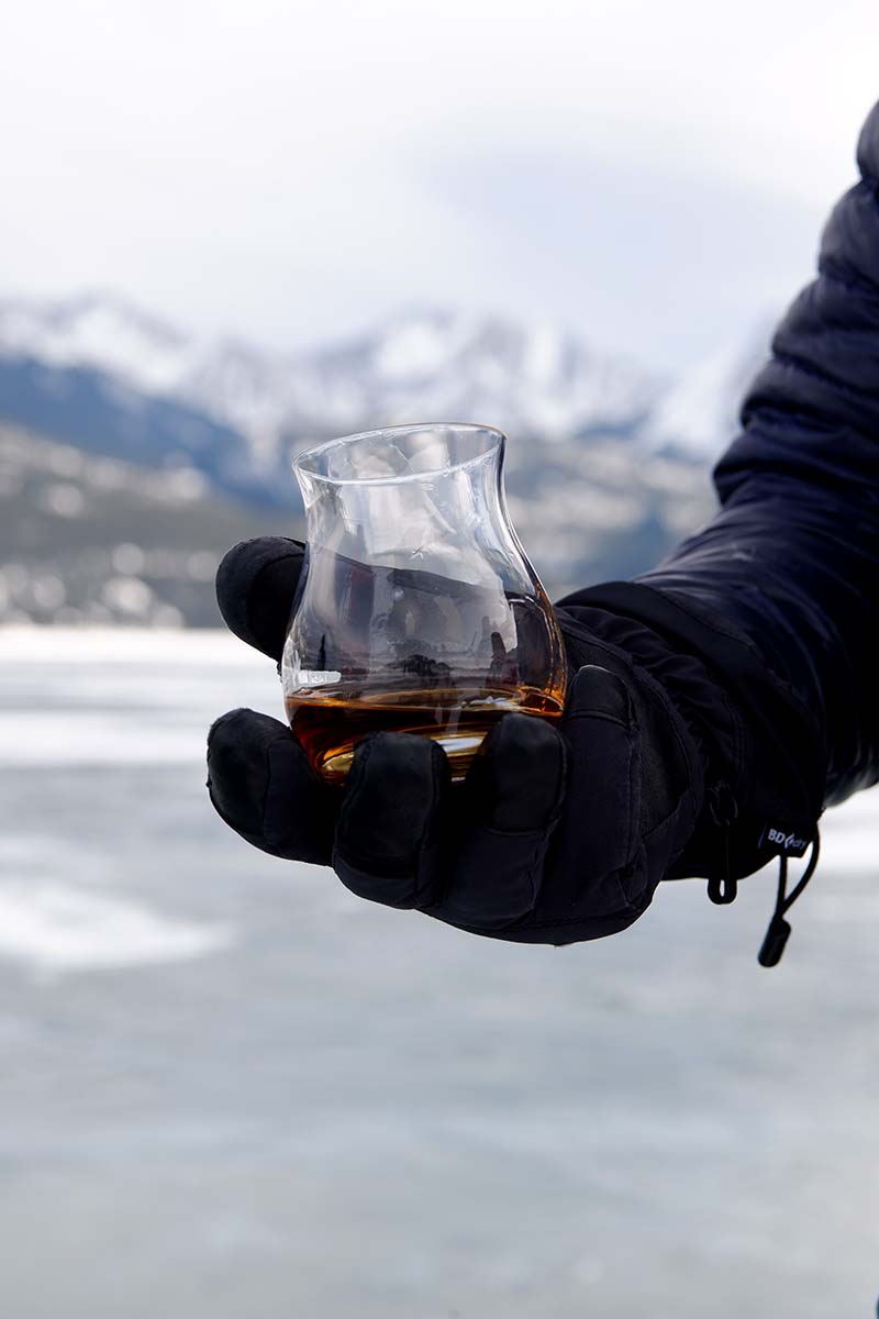 A drum of whisky held in a hand