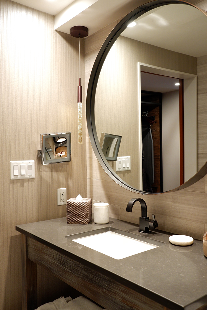 Salish Lodge & Spa bathroom vanity with a round mirror