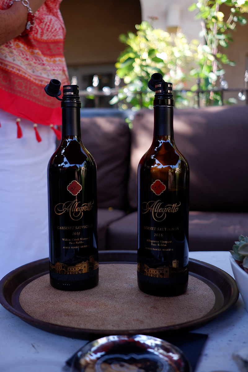 Allegretto Vineyard Resort: where art, wine, and romance meet in Paso Robles: two bottles of red wine on a tray