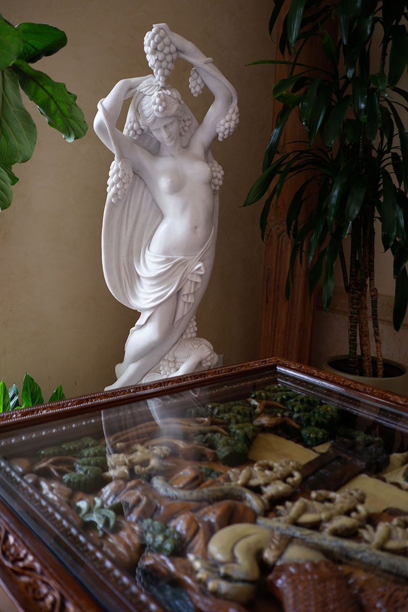 Female statue and carved table