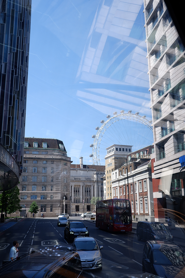 See London on a panoramic gourmet food bus, London Eye seen through the window